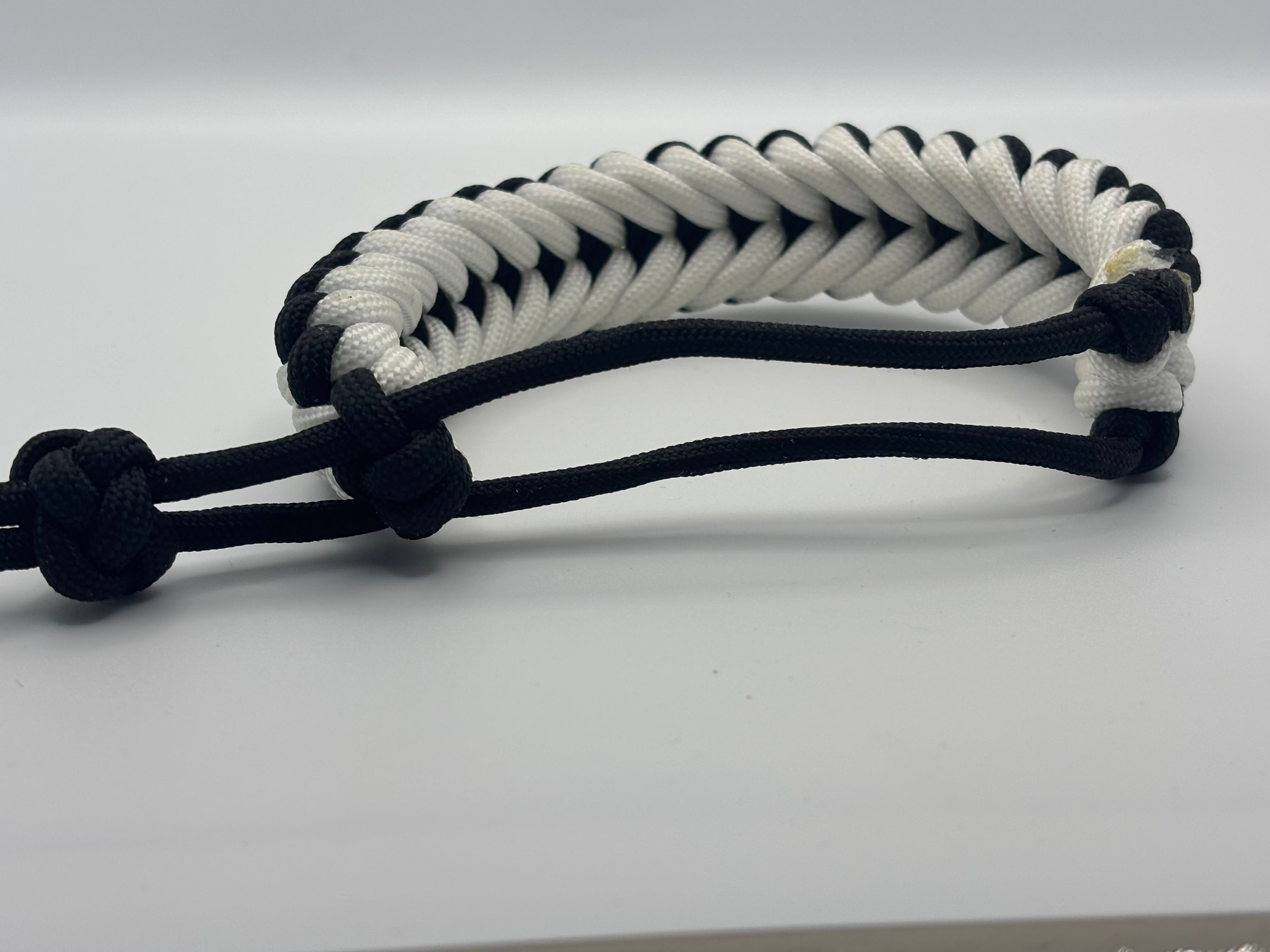 Handmade Grin of a Wolf Paracord Bracelet (Black/White) image 1